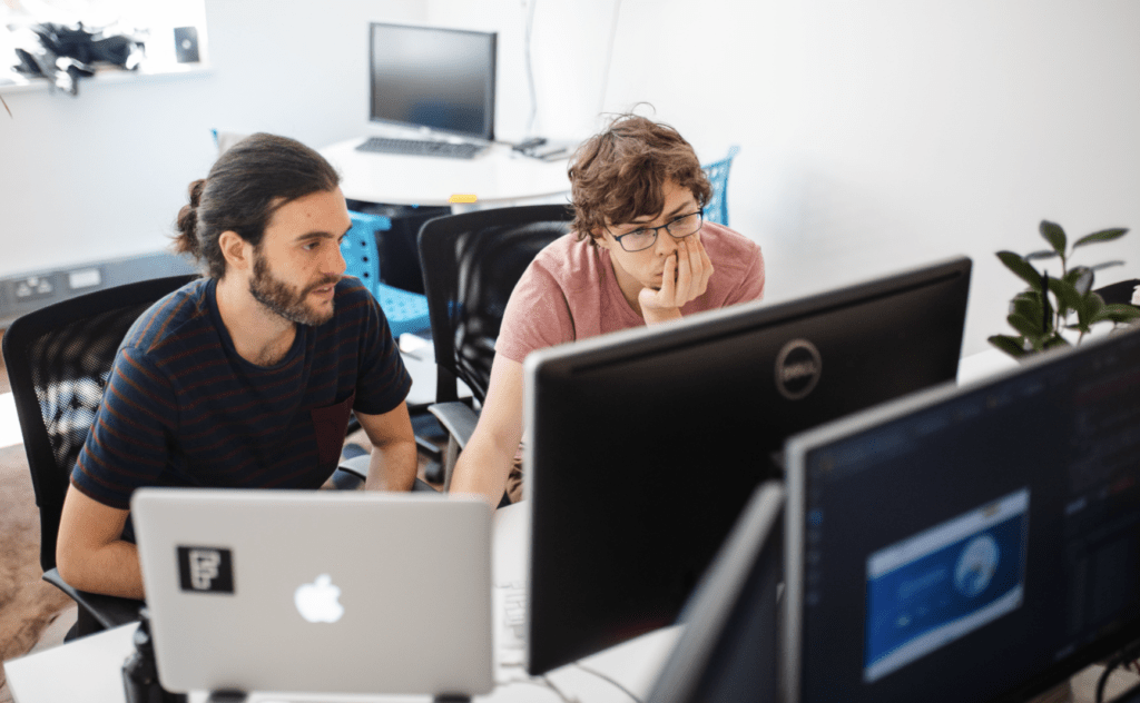 ClarityDX developers matt and Ibon looking at a screen