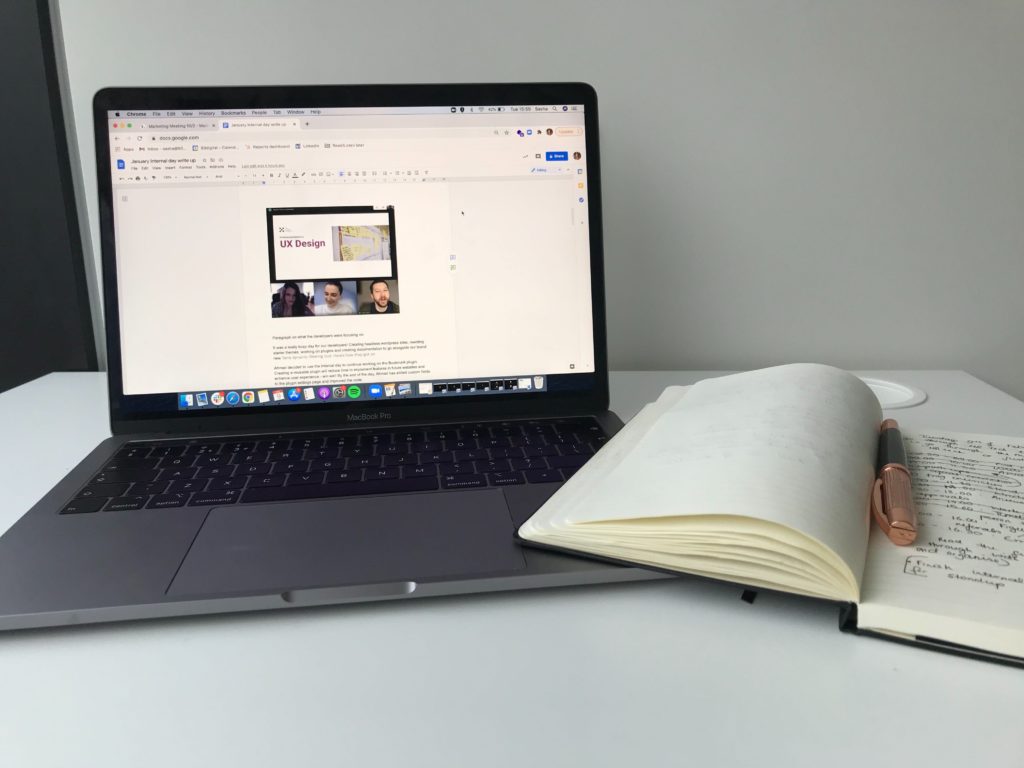 laptop and notebook on table